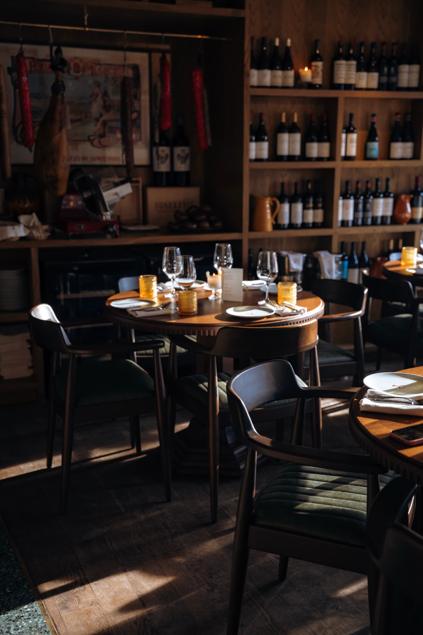 The wine wall and set tables in the Mesa Mesa dining room