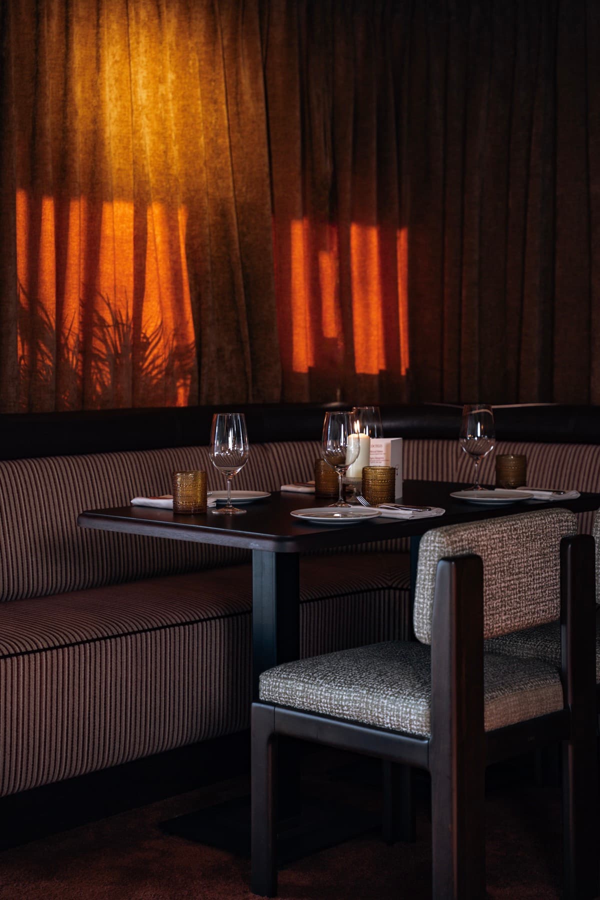 An intimate table set by candlelight at Mesa Mesa