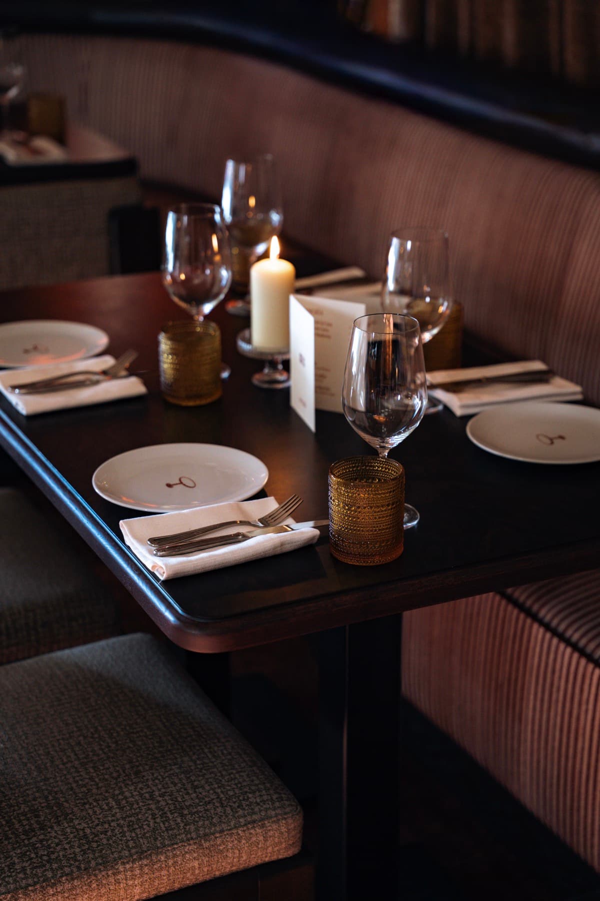 An intimate table set by candlelight in the evening