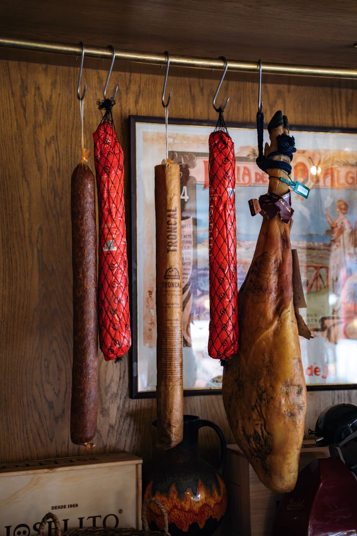 Chorizo and jamón hanging from hooks